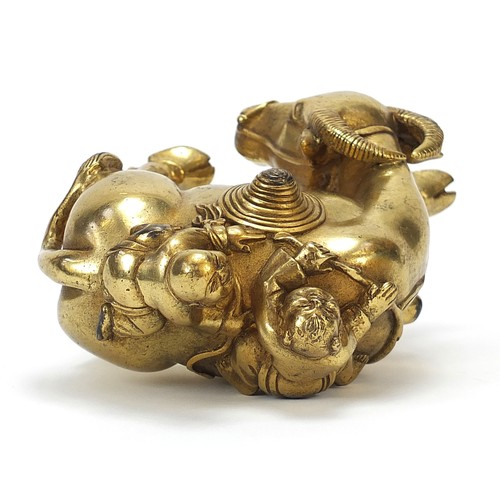 291 - Chinese gilt bronze figure of two boys on a water buffalo, 14cm high