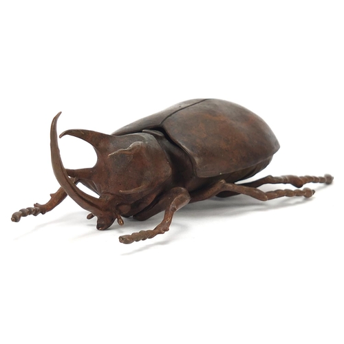 65 - Large Japanese patinated bronze beetle with articulated back, indistinct impressed marks to the unde... 