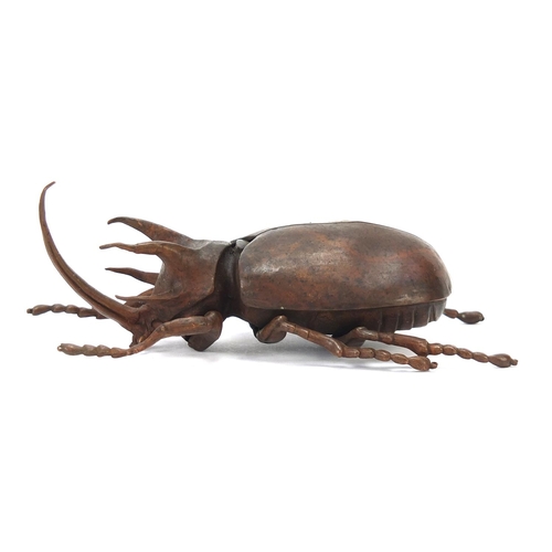 65 - Large Japanese patinated bronze beetle with articulated back, indistinct impressed marks to the unde... 