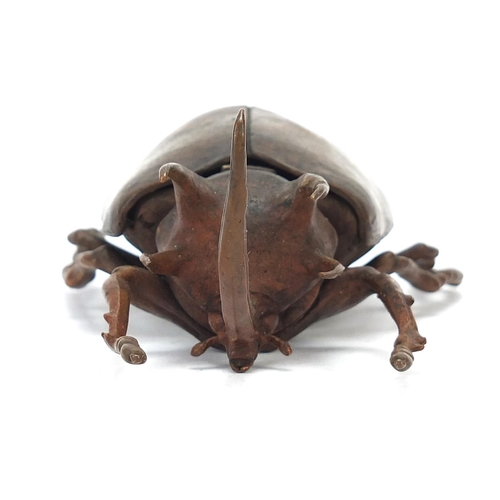 65 - Large Japanese patinated bronze beetle with articulated back, indistinct impressed marks to the unde... 