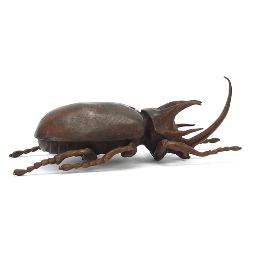 65 - Large Japanese patinated bronze beetle with articulated back, indistinct impressed marks to the unde... 