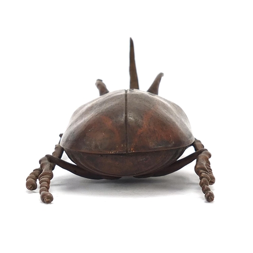 65 - Large Japanese patinated bronze beetle with articulated back, indistinct impressed marks to the unde... 