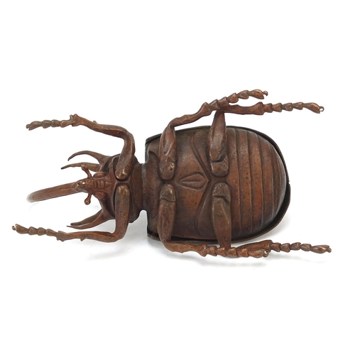 65 - Large Japanese patinated bronze beetle with articulated back, indistinct impressed marks to the unde... 