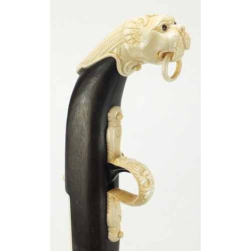 354 - Indian style hardwood and carved bone walking stick in the form of a rifle, 92cm in length