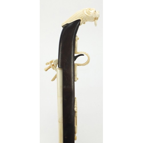 354 - Indian style hardwood and carved bone walking stick in the form of a rifle, 92cm in length