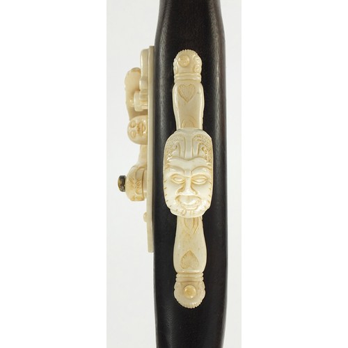 354 - Indian style hardwood and carved bone walking stick in the form of a rifle, 92cm in length