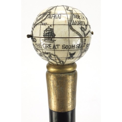 355 - Hardwood walking stick with carved bone globe and compass design pommel, 88cm in length