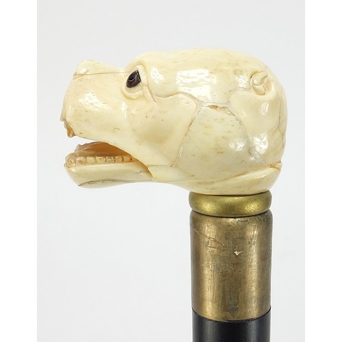 359 - Hardwood walking stick with carved bone dog design handle, 88.5cm in length