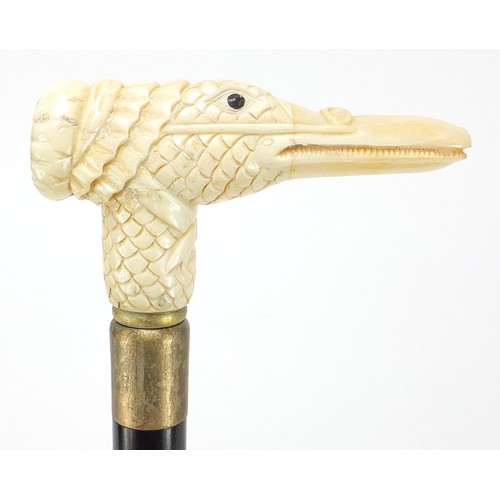 360 - Hardwood walking stick with carved bone duck design handle, 91.5cm in length