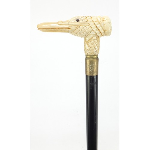 360 - Hardwood walking stick with carved bone duck design handle, 91.5cm in length