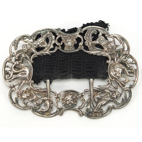 789 - Victorian silver buckle cast with Putti and a Persian two piece enamelled example, the largest 12.5c... 