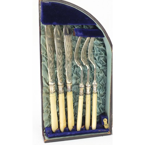 1085 - Silverplate comprising set of six Victorian aesthetic knives and forks with ivory handles housed in ... 