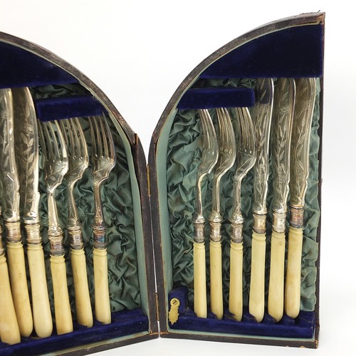 1085 - Silverplate comprising set of six Victorian aesthetic knives and forks with ivory handles housed in ... 