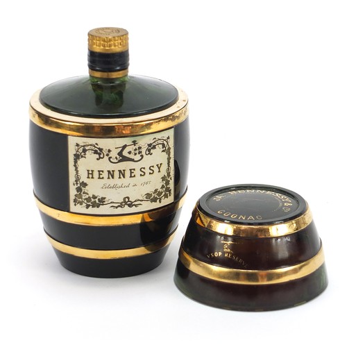 1086 - Bottle of Hennessey cognac housed in a barrel design glass bottle, 19cm high