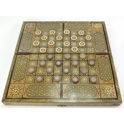 134 - Syrian Moorish design inlaid folding chess/games board with draughts, 40.5cm x 40.5cm