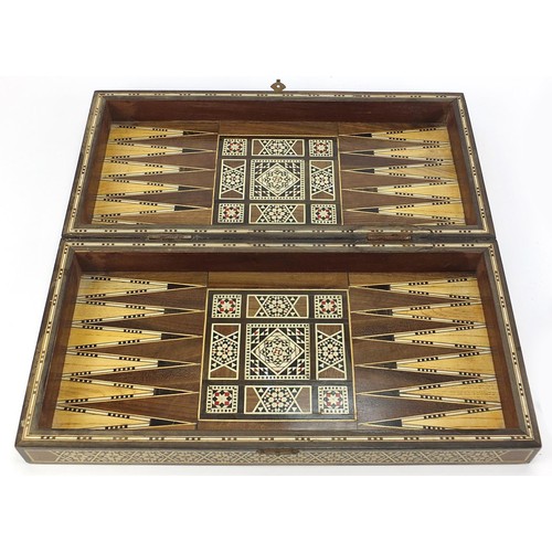 134 - Syrian Moorish design inlaid folding chess/games board with draughts, 40.5cm x 40.5cm