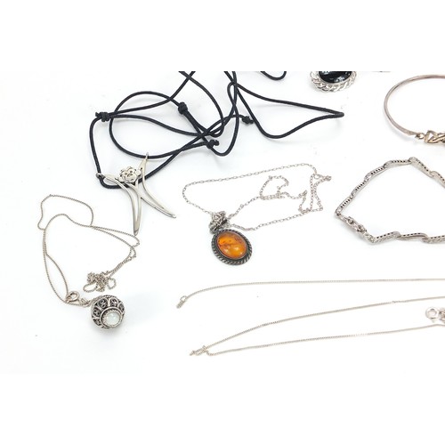 554 - Silver jewellery including silver gilt and hardstone handbag pendant, ring, cabochon stone brooches,... 