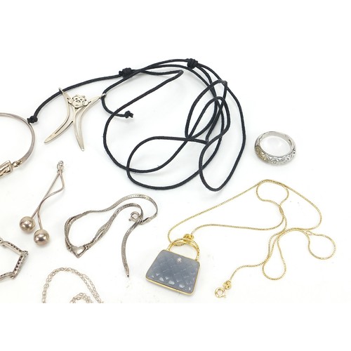 554 - Silver jewellery including silver gilt and hardstone handbag pendant, ring, cabochon stone brooches,... 