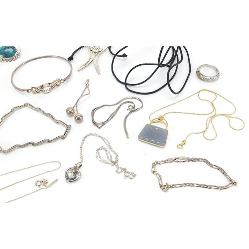 554 - Silver jewellery including silver gilt and hardstone handbag pendant, ring, cabochon stone brooches,... 