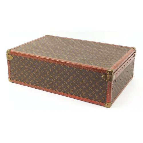 585 - Louis Vuitton, early 20th century suitcase with lift out tray, various impressed marks to the mounts... 