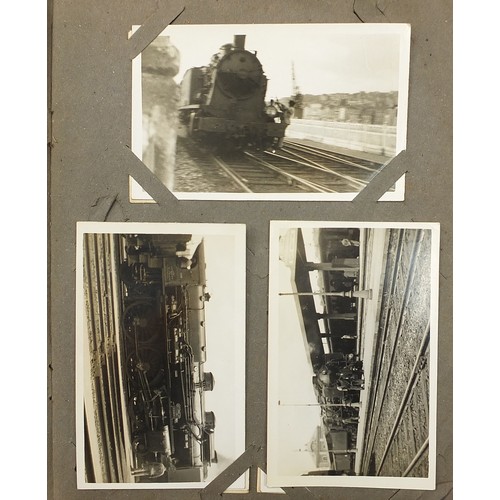 439 - Early 20th century postcards arranged in an album, predominantly photographic including railway loco... 