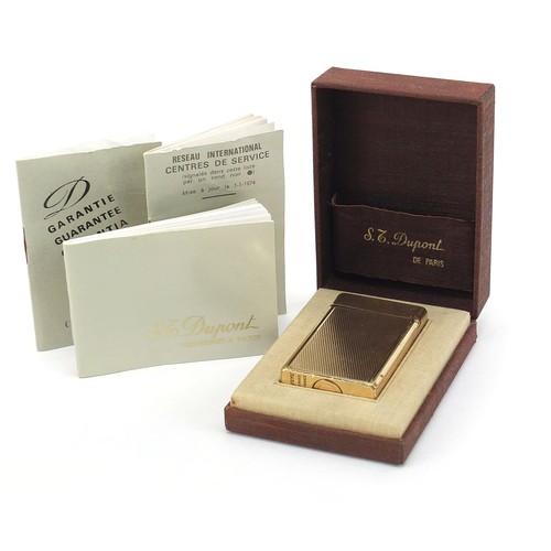 752 - S J Dupont, gold plated pocket lighter with engine turned decoration with box and paperwork, 6cm hig... 