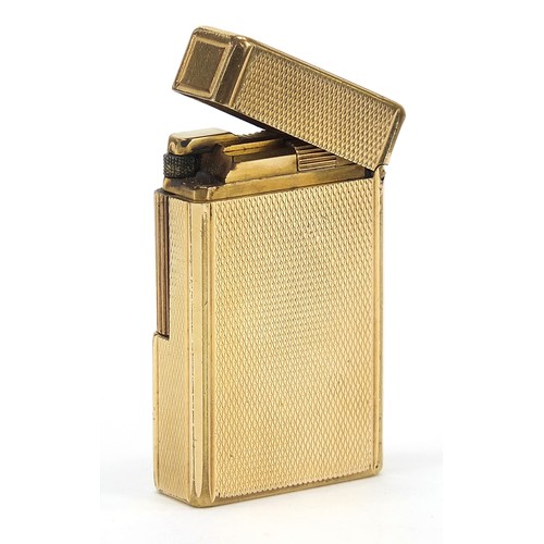 752 - S J Dupont, gold plated pocket lighter with engine turned decoration with box and paperwork, 6cm hig... 