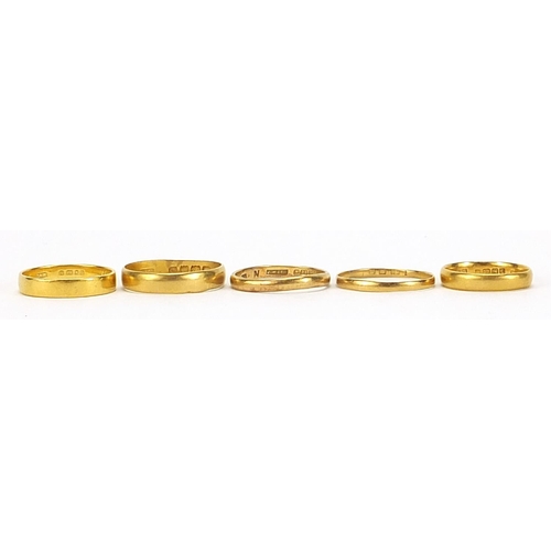 675 - Five Victorian and later 22ct gold wedding bands, London 1900, 1926, 1961, sizes P, O/P, L and Birmi... 