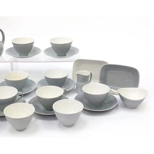 708 - Rorstrand, 1970's Swedish teaware including cups and plates, the largest 19cm in diameter