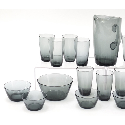 714 - Whitefriars and other smoky glassware including a lemonade jug with eleven glasses, the largest 21.5... 