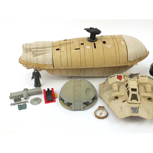 2025 - Vintage Star Wars toys including a Millennium Falcon and a Rebel Transport