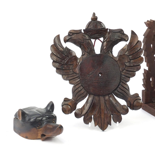 842 - Black forest wood carvings including a dog's head inkwell with ceramic liner and an extending book s... 