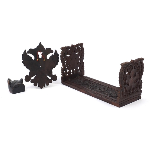 842 - Black forest wood carvings including a dog's head inkwell with ceramic liner and an extending book s... 