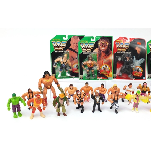 923 - 1990's and later WWF wrestling action figures including six with blister packs together with a small... 