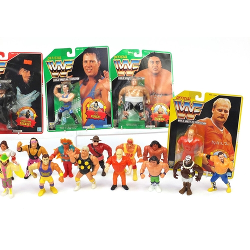 923 - 1990's and later WWF wrestling action figures including six with blister packs together with a small... 