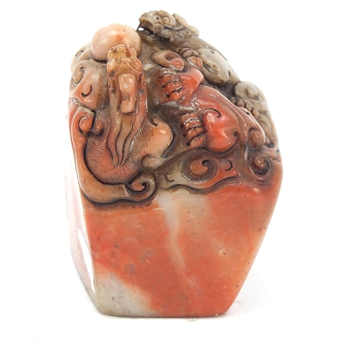 384 - Chinese soapstone seal carved with dragons, character marks to the base, 6.5cm high