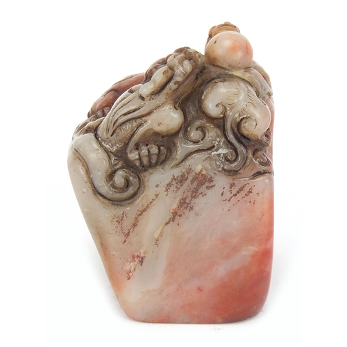 384 - Chinese soapstone seal carved with dragons, character marks to the base, 6.5cm high