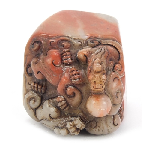 384 - Chinese soapstone seal carved with dragons, character marks to the base, 6.5cm high