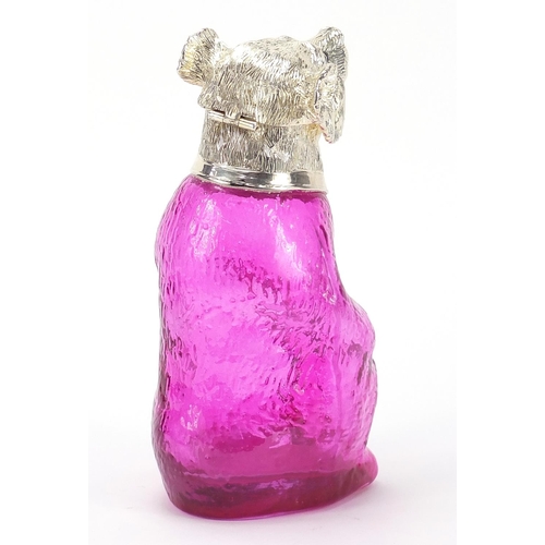 716 - Silver plated and cranberry coloured glass claret jug in the form of a seated bear, 22.5cm high