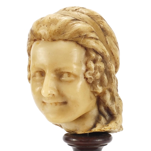 105 - Wax bust of a female raised on turned mahogany pedestal base, 41.5cm high