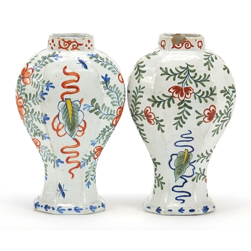 577 - Pair of antique Delft tin glazed baluster vases, each hand painted with a panel of female in a lands... 