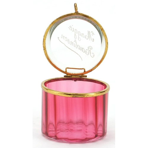 134 - 19th century cranberry glass casket with gilt metal mounts, etched Maggie Rawlinson, 7cm in diameter