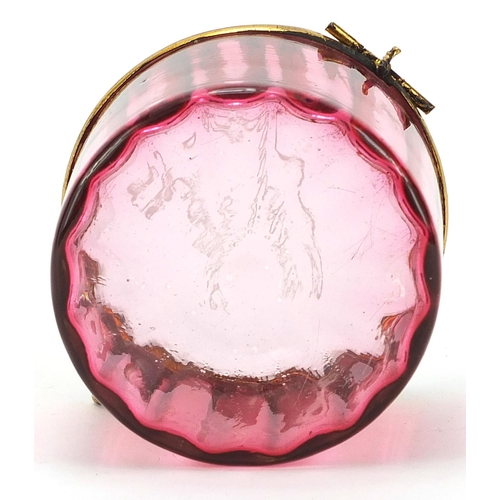 134 - 19th century cranberry glass casket with gilt metal mounts, etched Maggie Rawlinson, 7cm in diameter