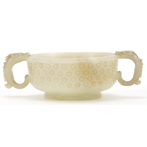24 - Chinese white jade libation cup with dragon handles, 12cm high
