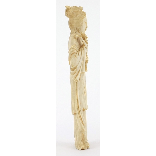 169 - Japanese carved ivory okimono of a young female holding a fan and flowers, 18cm high