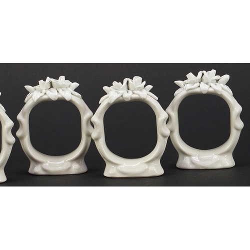 2037 - Set of six German floral encrusted napkin ring holders, each 5.5cm high