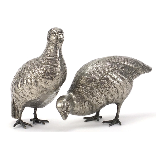 2080 - Pair of silver plated peahens, the largest 16.5cm high