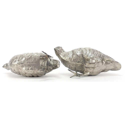 2080 - Pair of silver plated peahens, the largest 16.5cm high