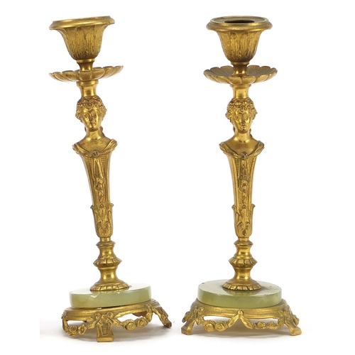 1959 - Pair of gilt metal and onyx figural candlesticks and sculpture of a lion, the largest each 17cm high