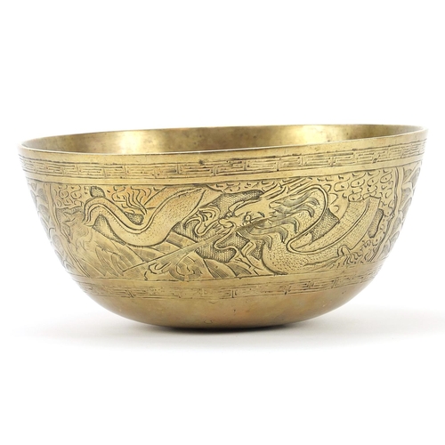 2032 - Chinese patinated bronze dragon bowl, 24.5cm in diameter